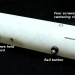 Screws holding centering ring and shock cord